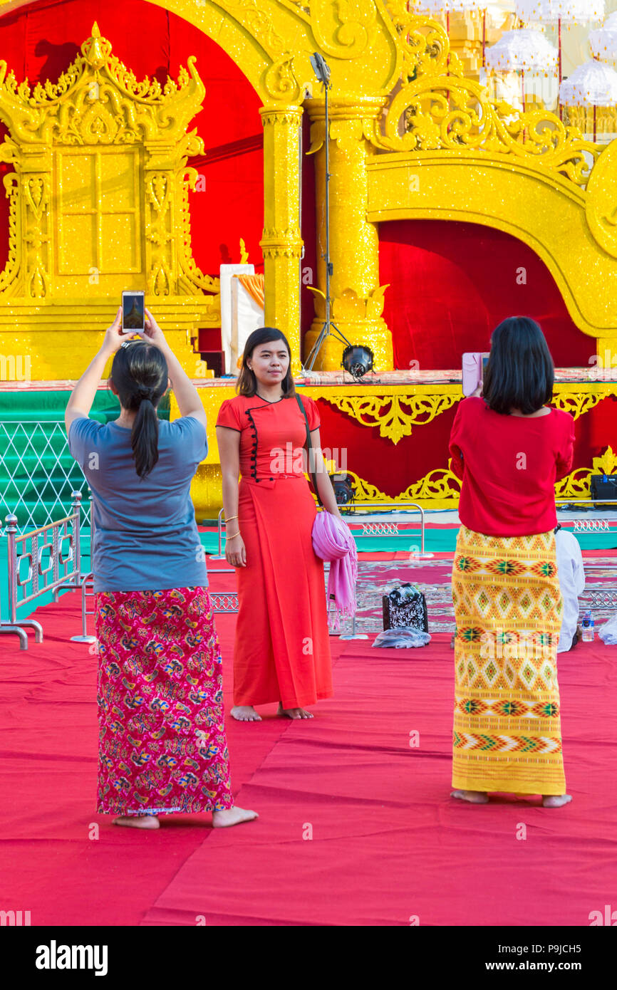 Tourists taking photos at Shwedagon Pagoda, Yangon, Myanmar (Burma), Asia in February Stock Photo