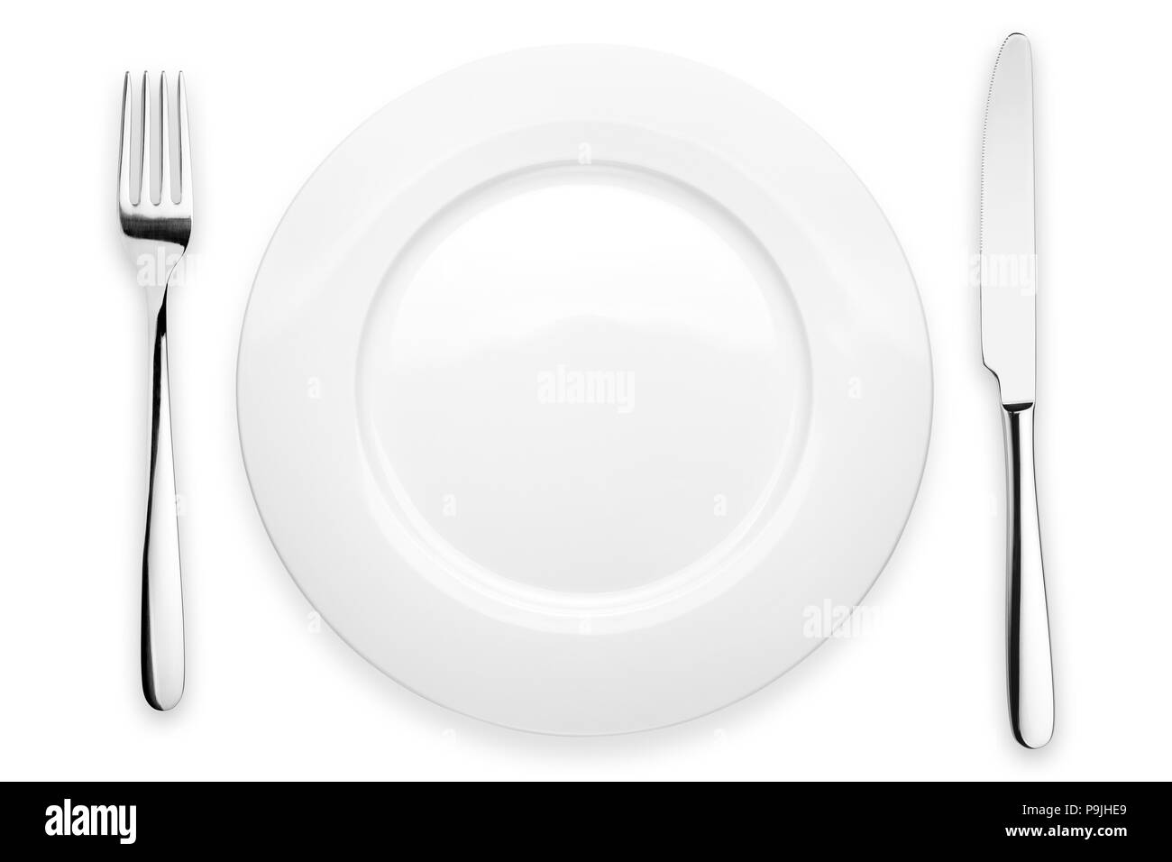 Empty plate, fork, knife, clipping path, white background, isolated, top view from first person Stock Photo
