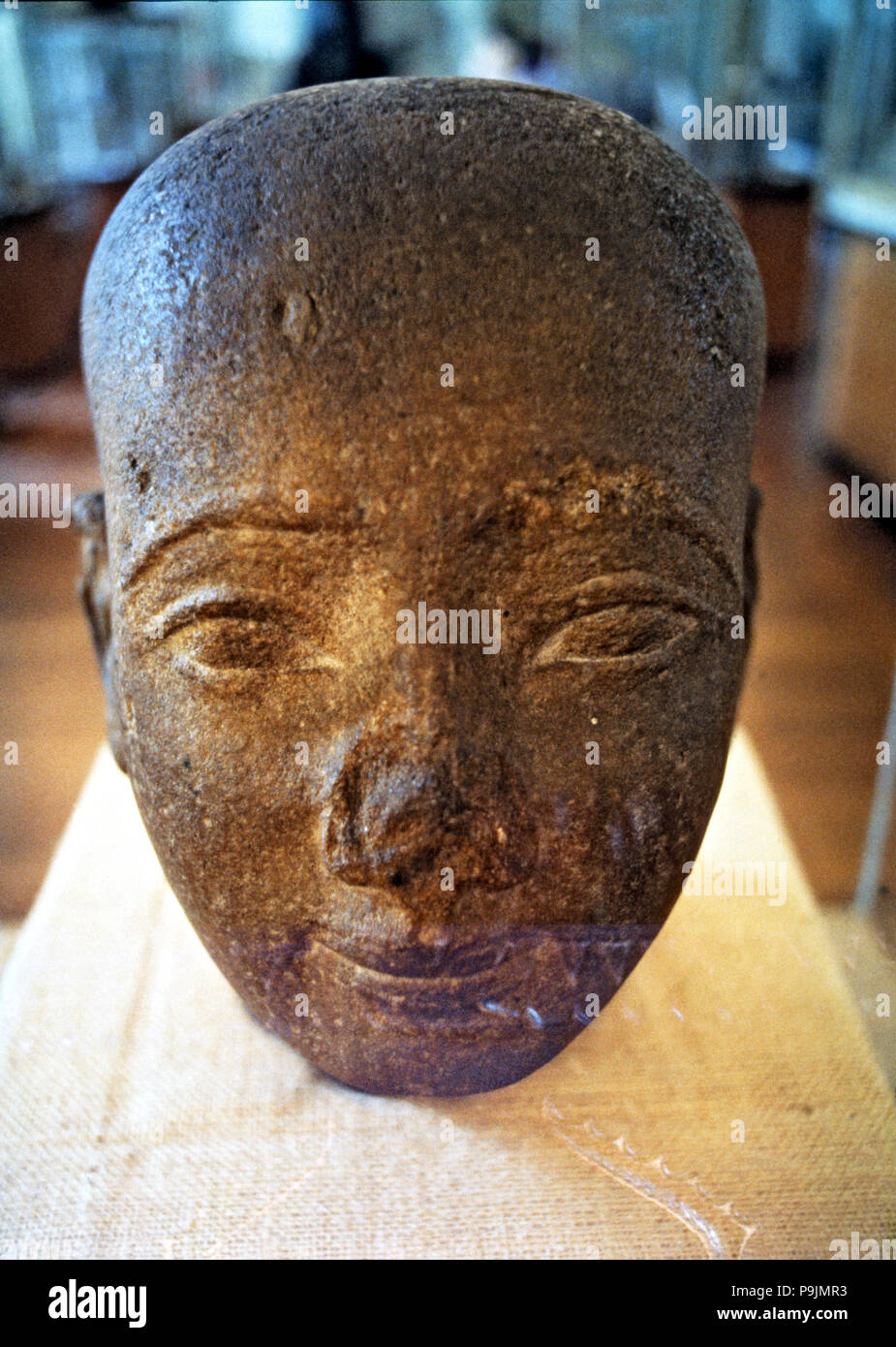 Egyptian art. Head in red granite from the New Kingdom era. Stock Photo