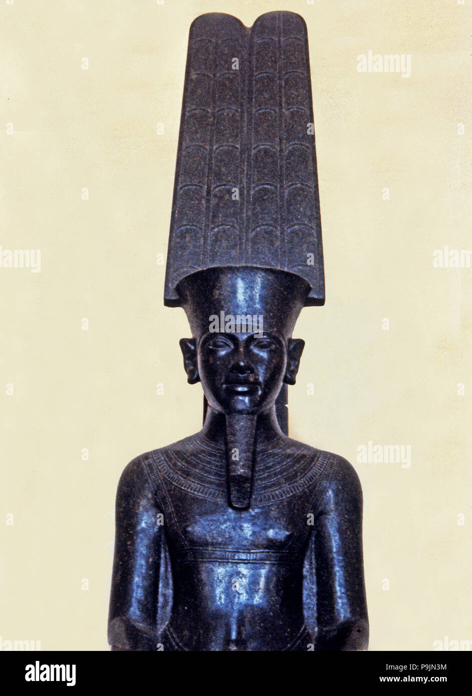 Statue of the god Amon protecting Tutankhamen, made in black granite, 1350 b.C, detail of the top… Stock Photo
