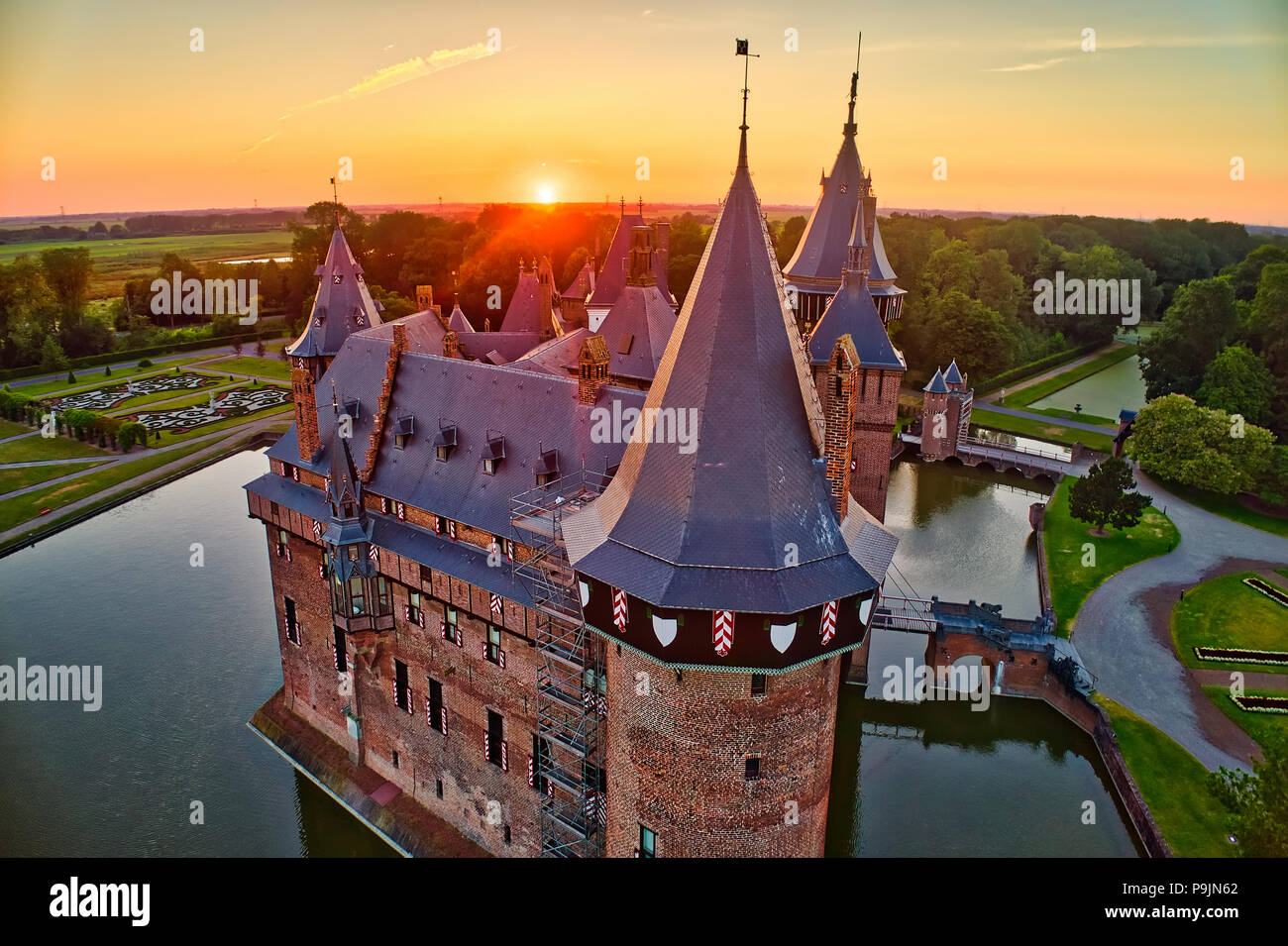 Aerial view of the medieval castle De Haar at sunset in Netherlands, Europe. Current buildings all built upon the original castle date from 1892. HDR  Stock Photo