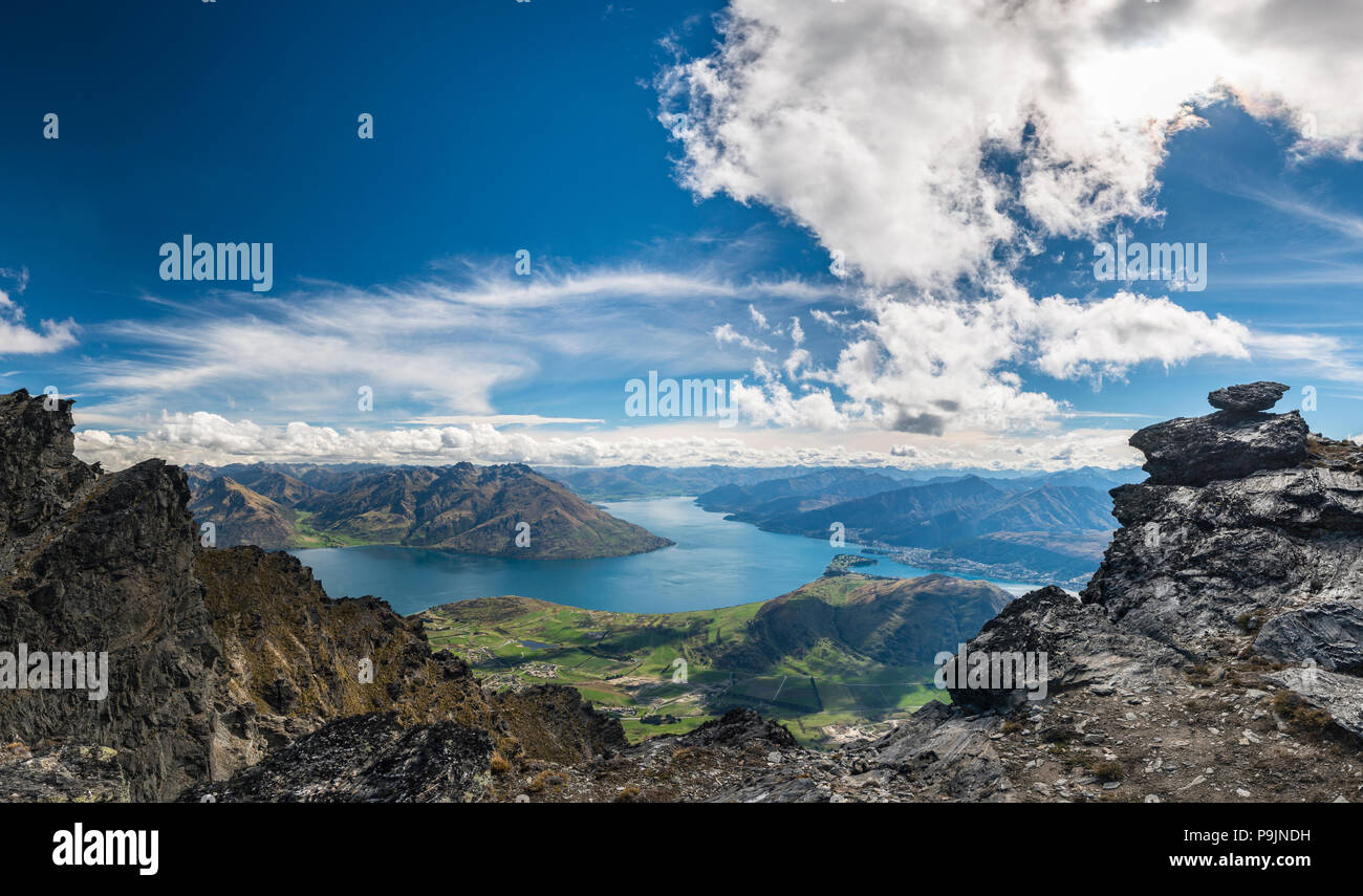 View from the mountain range The Remarkables to Lake Wakatipu and mountains, Queenstown, Otago, South Island, New Zealand Stock Photo