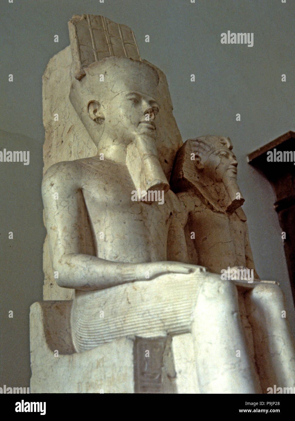 Amon seated next to Tutankhamun, statue made in calcite, 1350 BC. Stock Photo