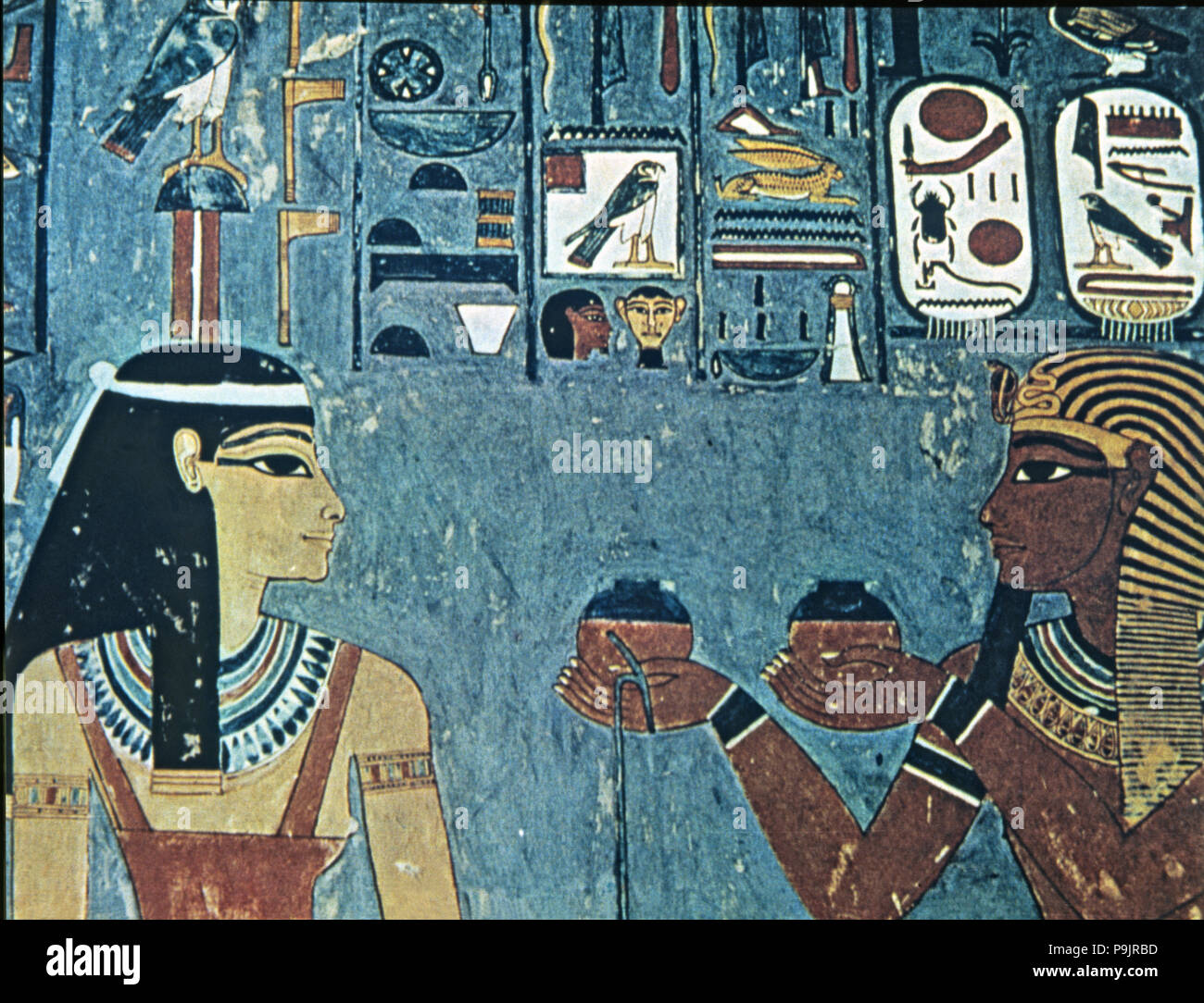 Fresco in the tomb of Horemheb, representing the pharaoh giving offerings to goddess Hathor. Stock Photo