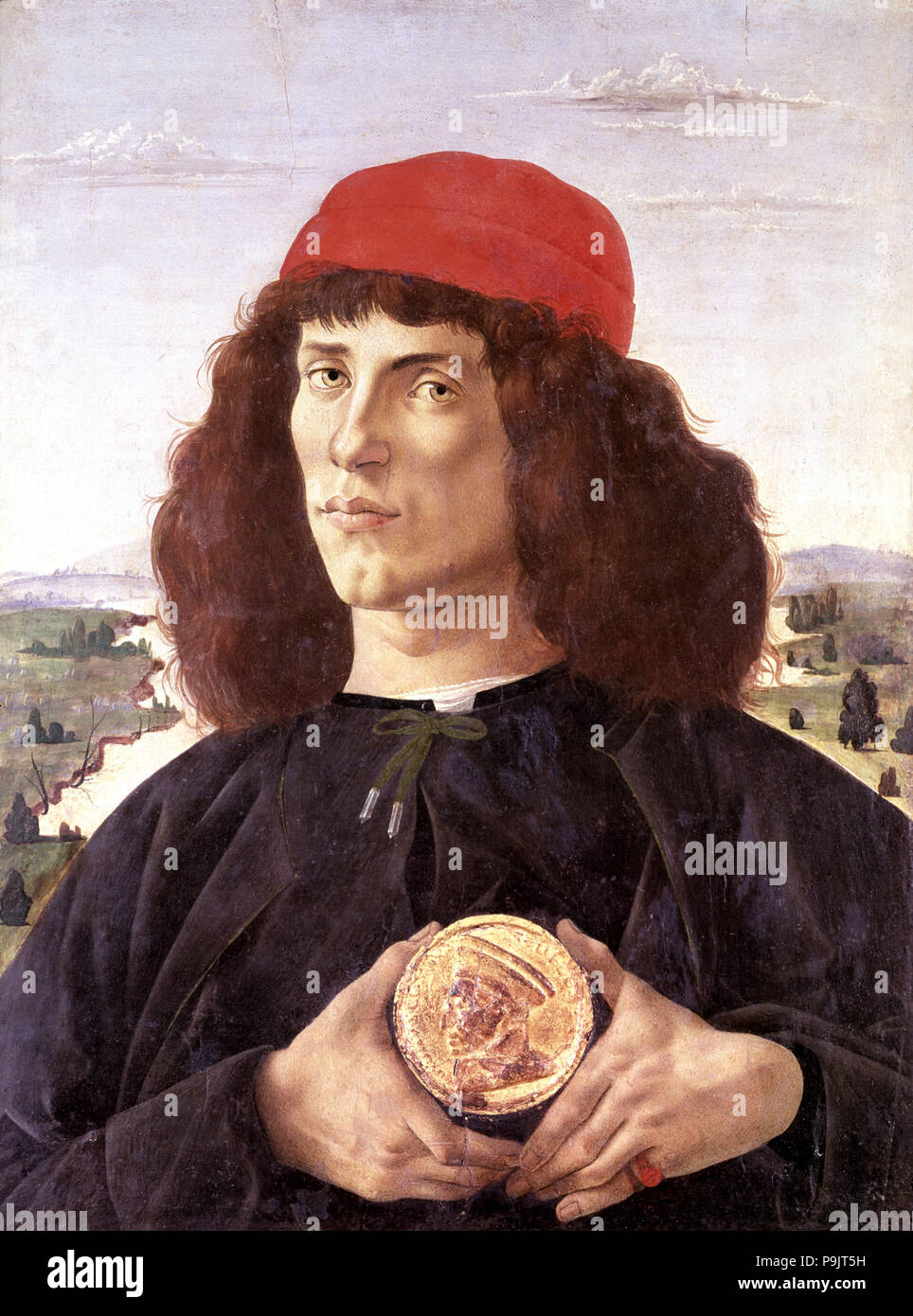 Portrait of unknown man with the medal of Cosimo the Elder', painting by Sandro Botticelli (1444 … Stock Photo