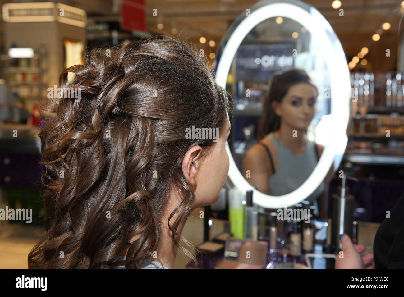 Teenage Girl Having Make Up Applied For Prom Stock Photo