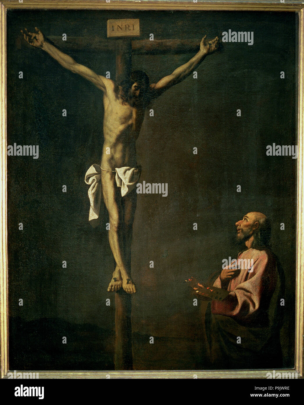 'Saint Luke as a painter before Christ on the Cross'. Stock Photo