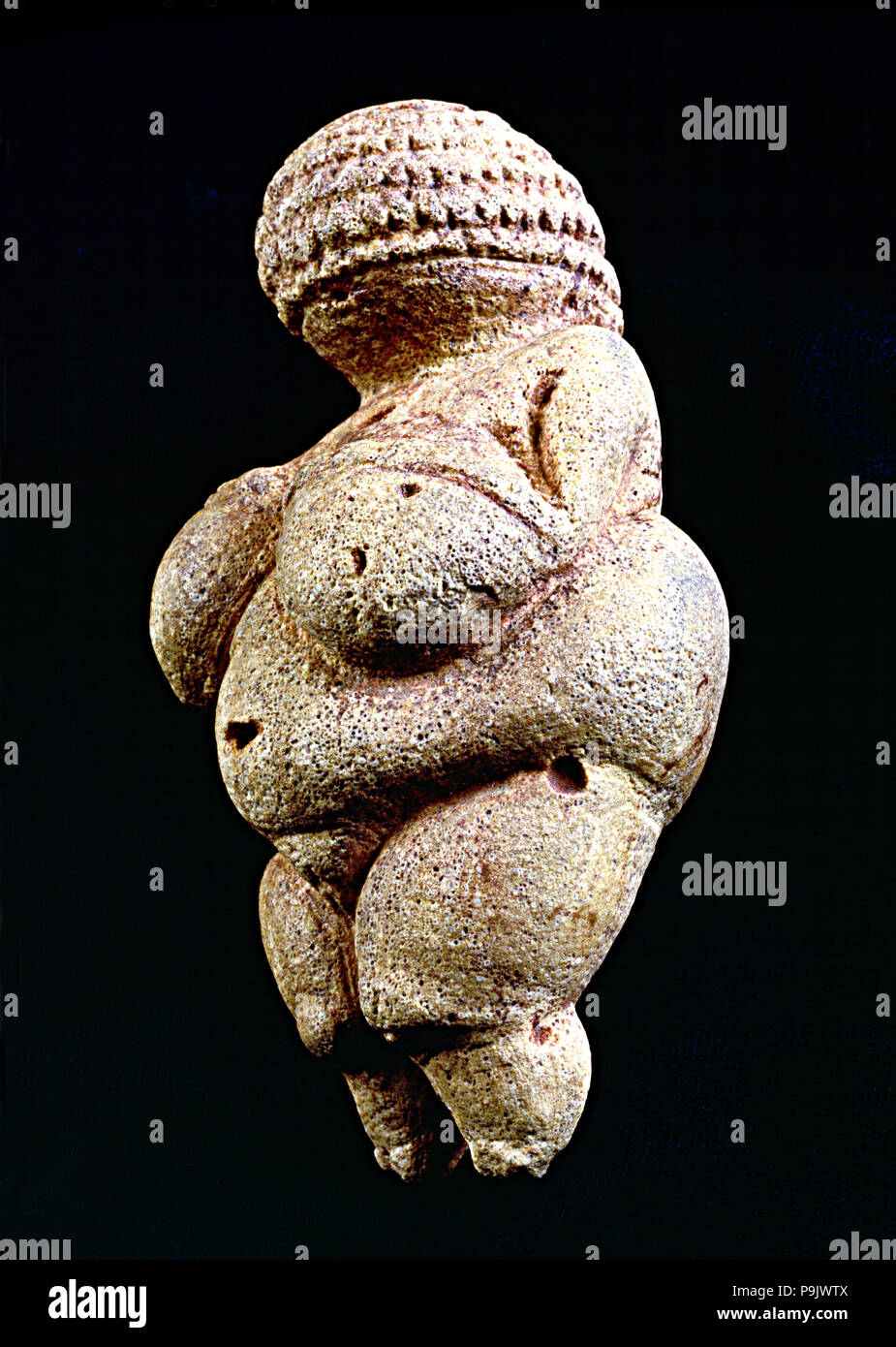 Venus of Willendorf', 110 mm.: woman statue made in limestone and painted with ochre. It is rhomb… Stock Photo