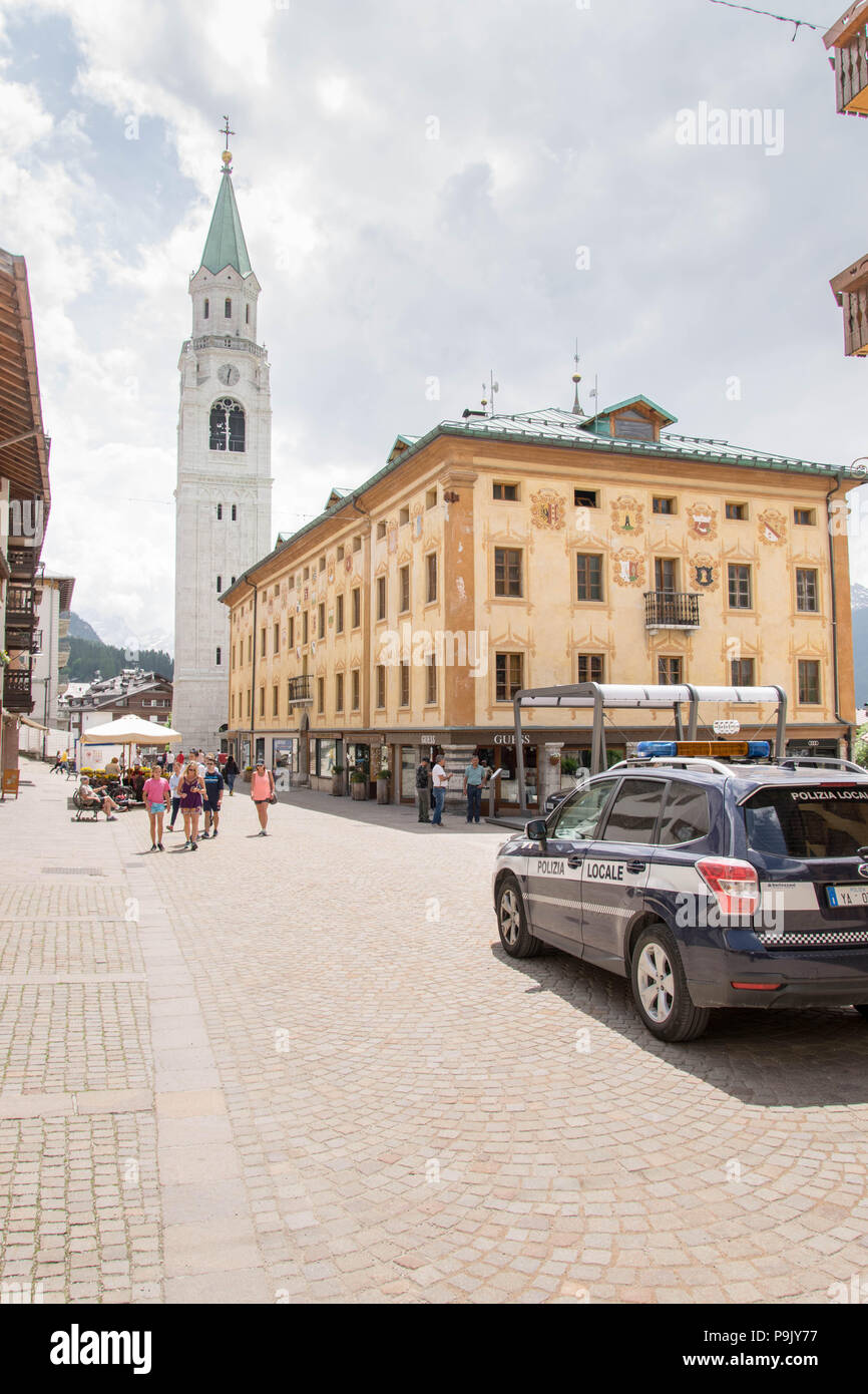 Europe, Italy, Veneto, Cortina d'Ampezzo - Police car, officers on duty providing security at the Cortina city centr, Corso Italia street Stock Photo