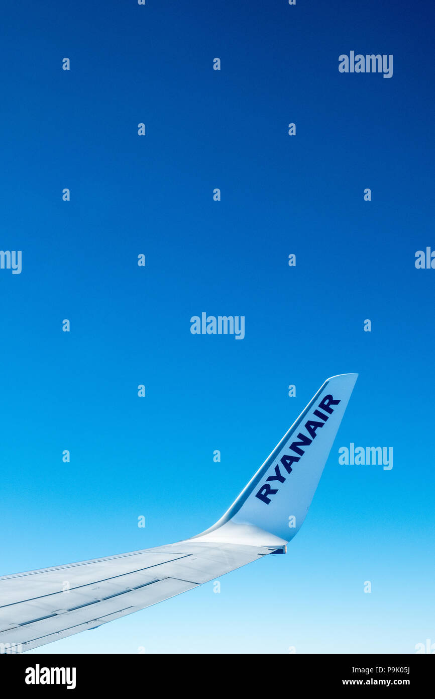 Ryanair airplane wing and blue skies Stock Photo