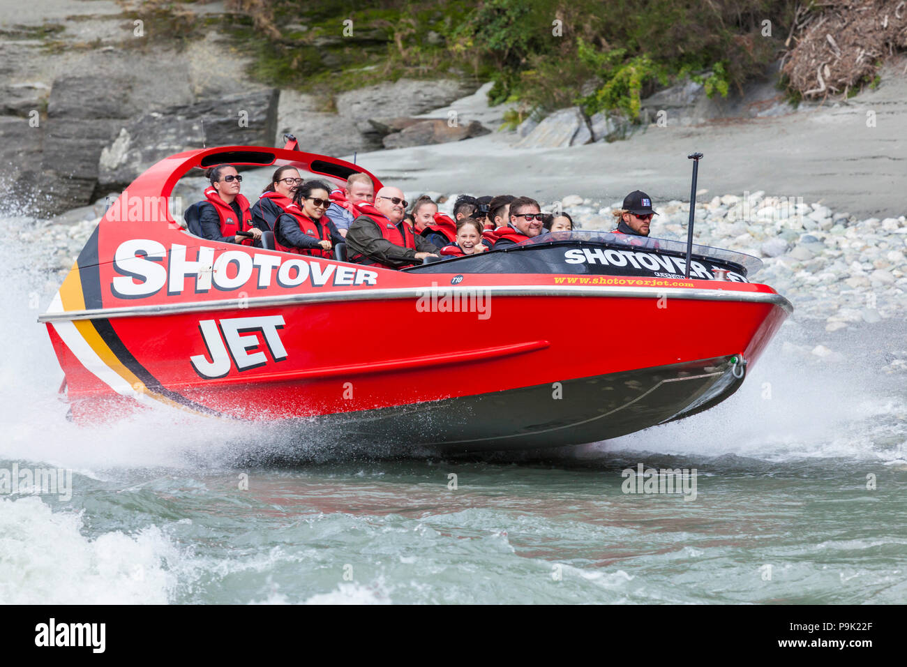 queenstown new zealand people enjoying the thrill of the shotover jet boat jet boating on the shotover river queenstown new zealand nz Stock Photo