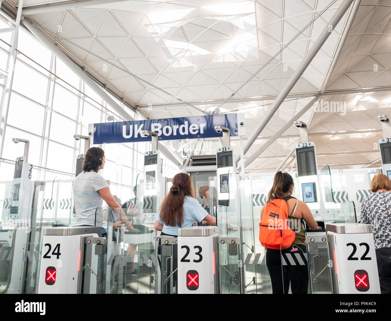 Passengers using the ePassport gates at UK border control, Stansted Airport, UK Stock Photo