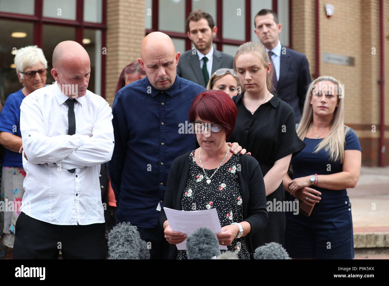Tracy Lewis (centre) and Tony Benton (left) read a statement outside Woking Coroner's Court, following the verdict of the inquest into the death of their brother, Private Sean Benton, at Deepcut Army Barracks. The 20-year-old was found with five bullets in his chest at the Surrey base in June 1995, shortly after he had been told he was to be discharged from the military. Stock Photo