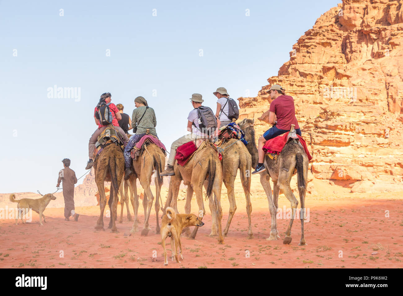 WADI RUM DESERT, JORDAN APRIL 30, 2016 Tourists riding on camels