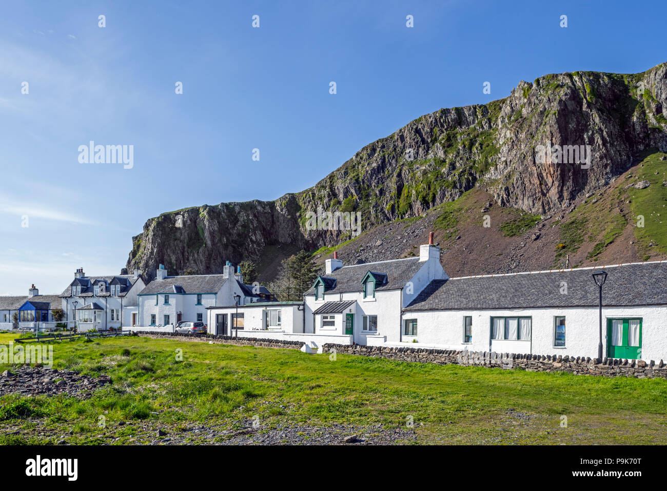 Row of white houses in former slate-mining village Ellenabeich on the isle of Seil, Argyll and Bute, Scotland, UK Stock Photo