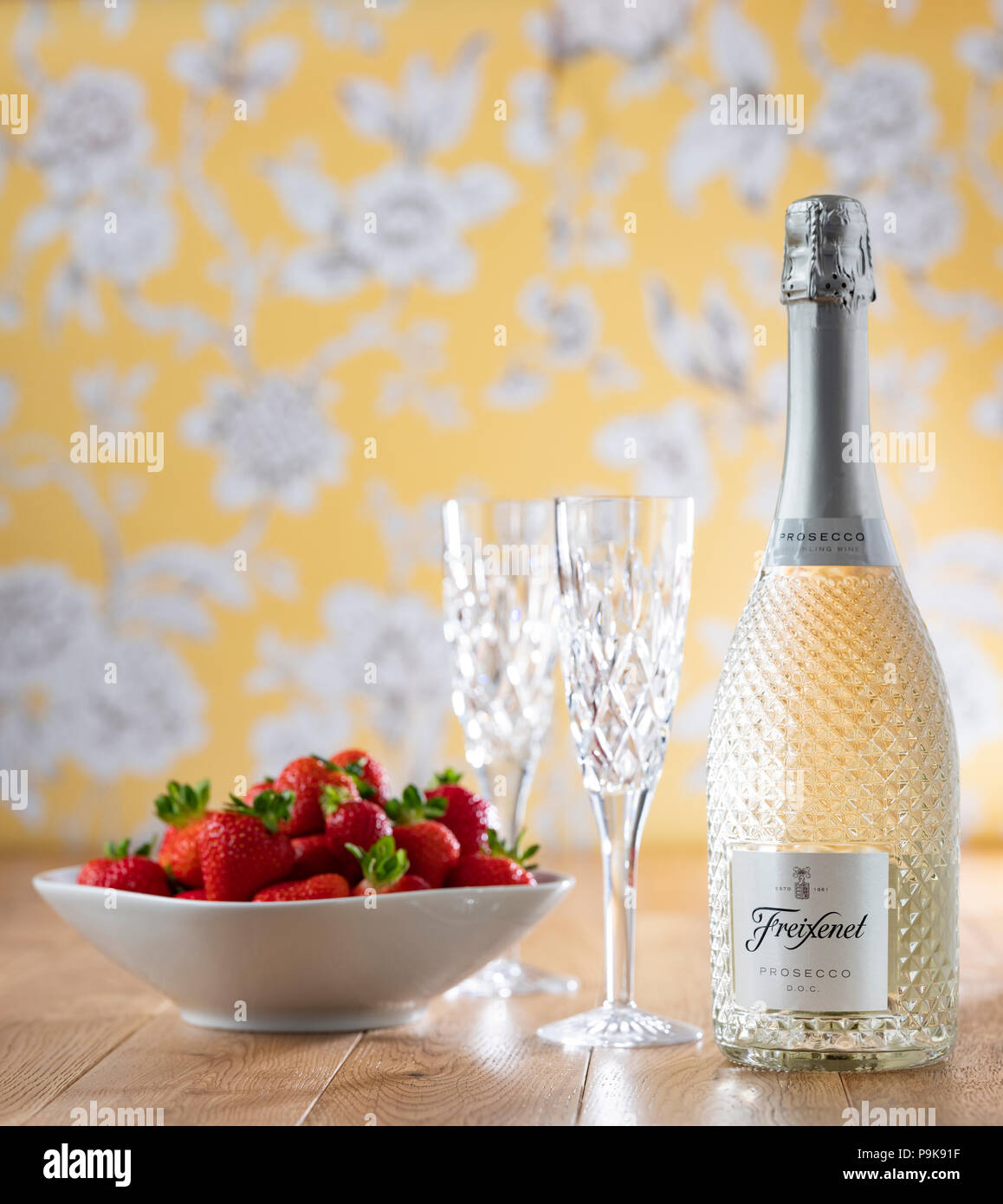 Prosecco and Strawberries cut crystal glasses flower wallpaper wooden