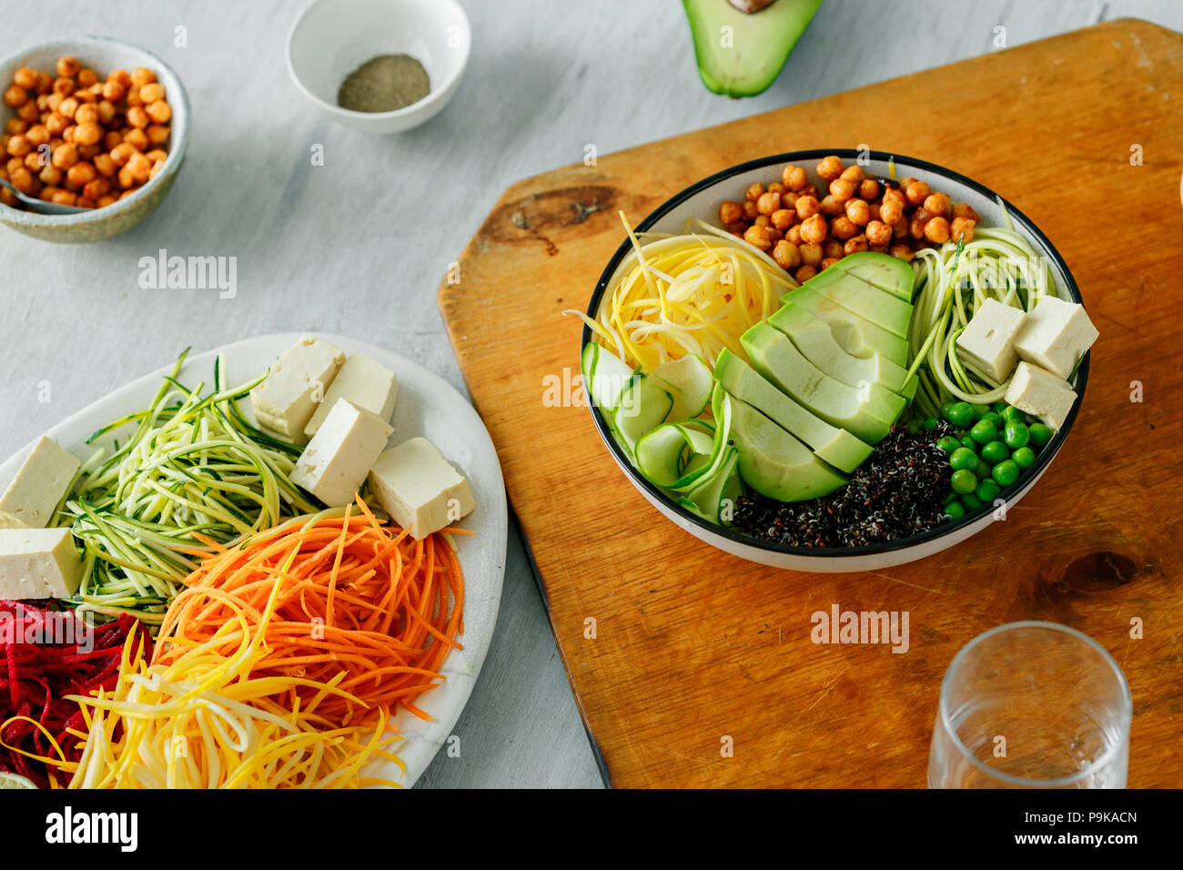 Bowl of buddha with spiralized vegetables on white wooden table. Healthy food clean eating Stock Photo