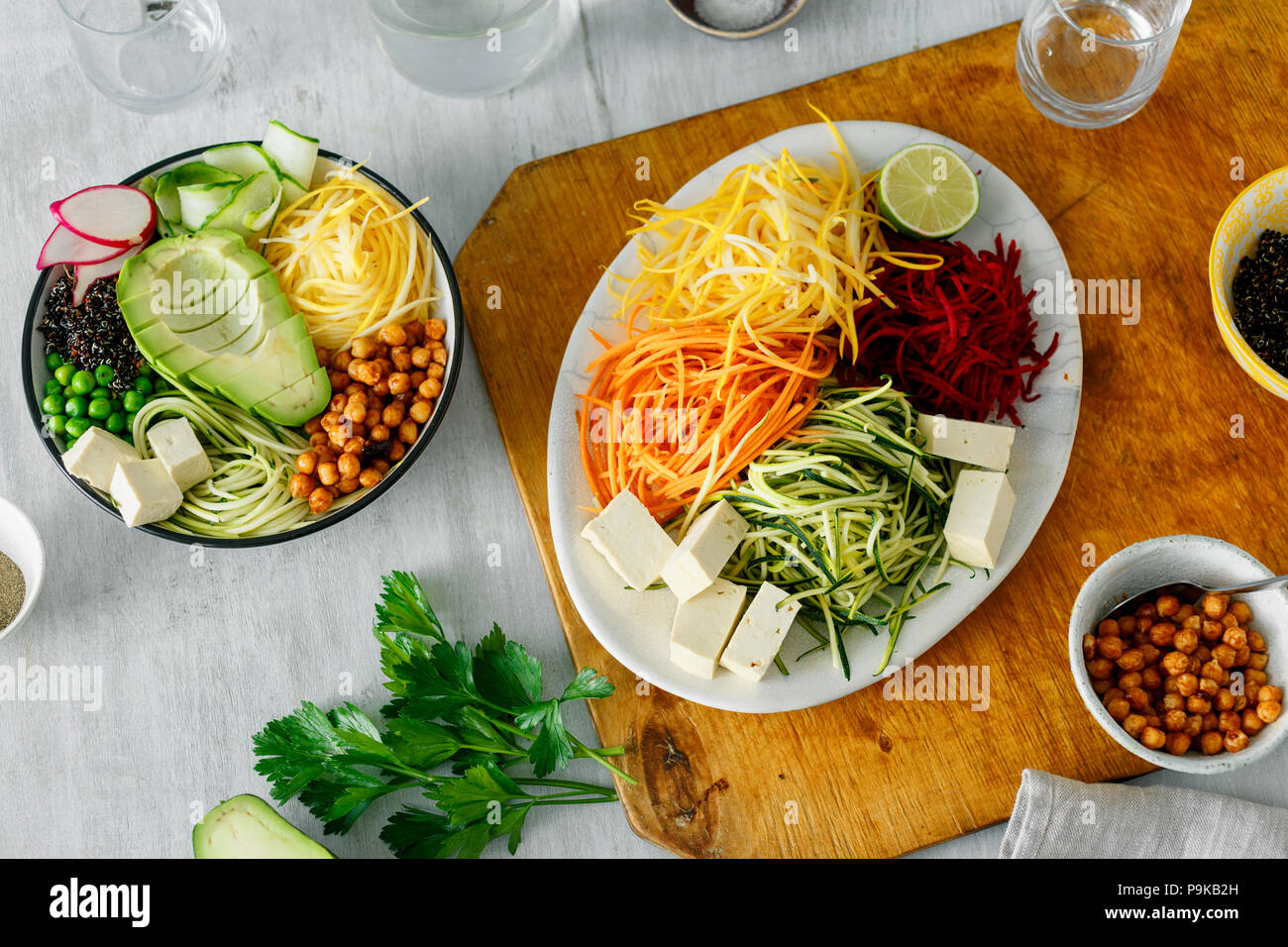 Bowl of buddha with spiralized vegetables on white wooden table, top view. Healthy food clean eating Stock Photo