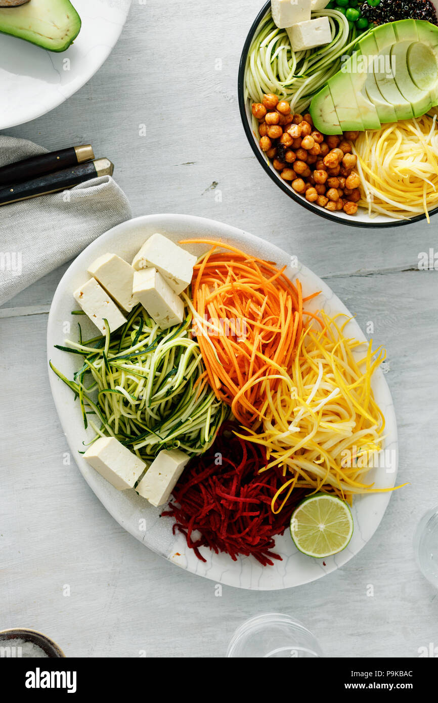 Bowl of buddha with spiralized vegetables on white wooden table, top view. Healthy food clean eating food Stock Photo