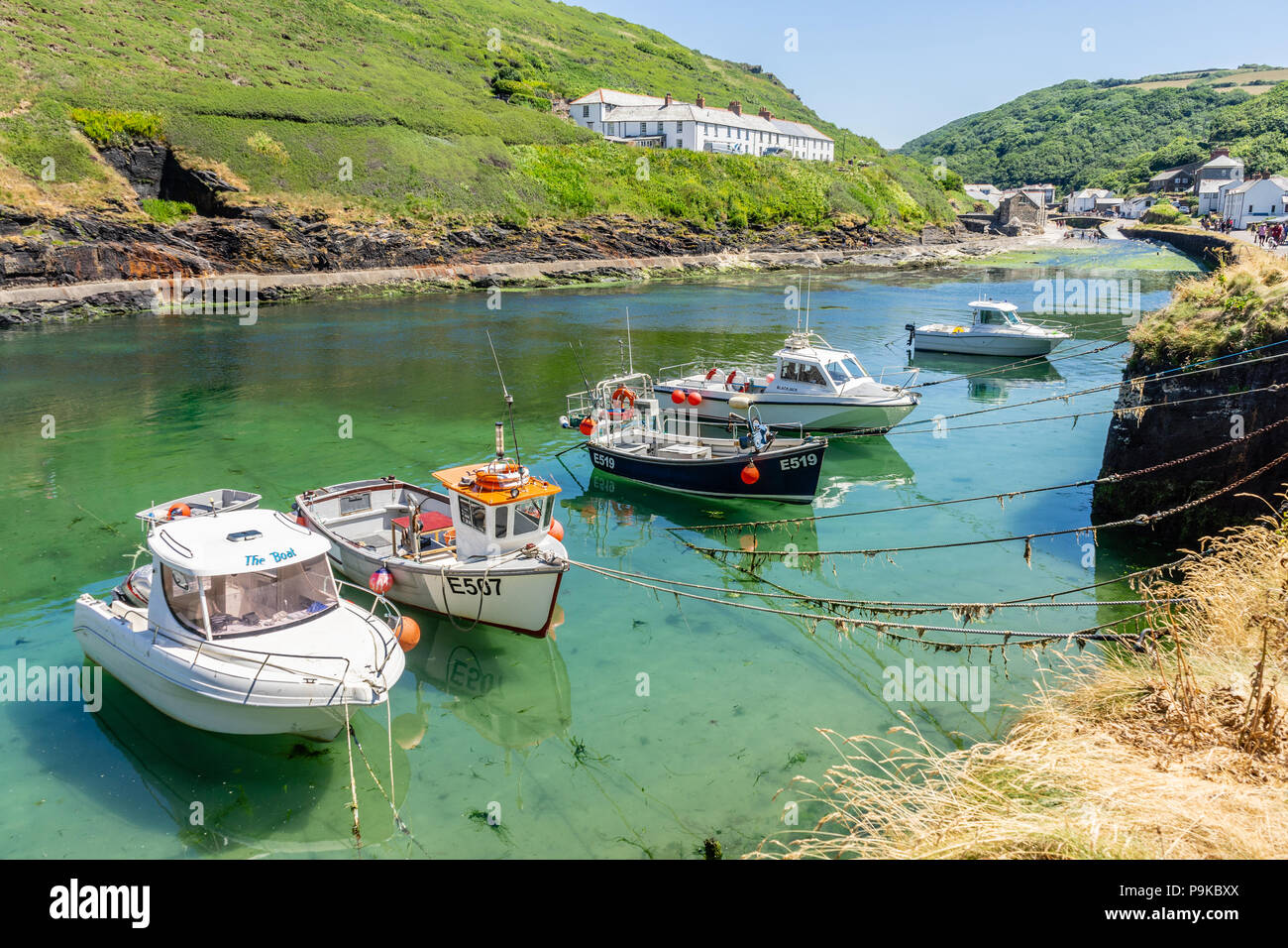 View of Boscastle with boats moored along the small harbour in summer 2018, Boscastle, North Cornwall, Cornwall, England, UK Stock Photo