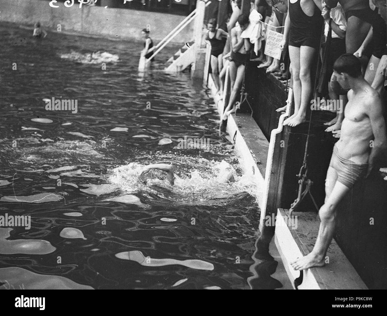 265 SLNSW 43469 Swimming carnival with visiting Japanese swimmers at the Domain Baths Stock Photo