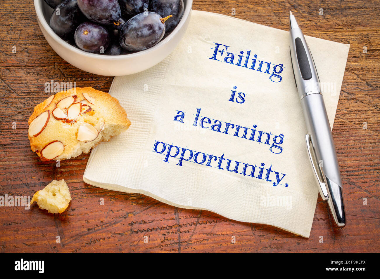 Failing is a learning opportunity - handwriting on a napkin with a cup of coffee Stock Photo