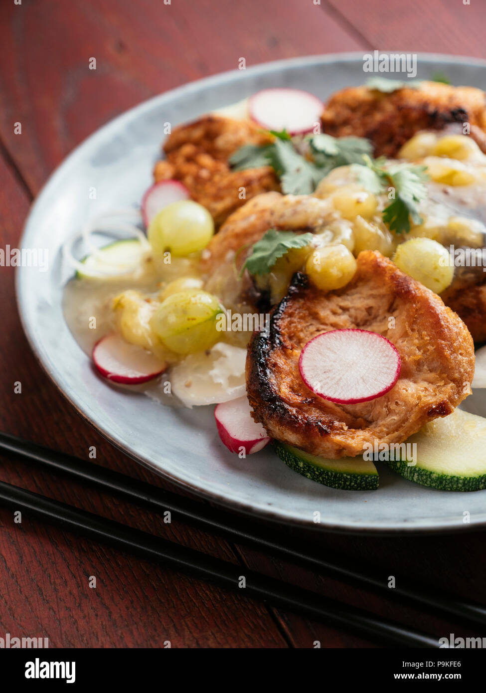 Asian Barbecued TVP Medallion Salad with Gooseberry Sauce. Stock Photo