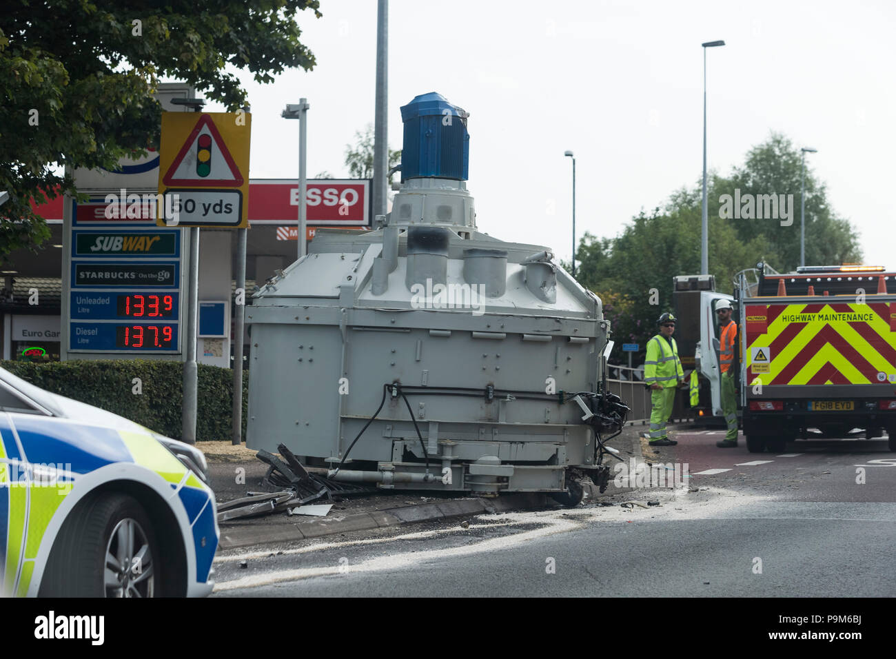 A50, Uttoxeter, Staffordshire, UK. 19th July 2018. A cement mixer which has fallen from a lorry on the side of the road on the McDonalds roundabout, A50, Uttoxeter. Credit: Richard Holmes/Alamy Live News Stock Photo