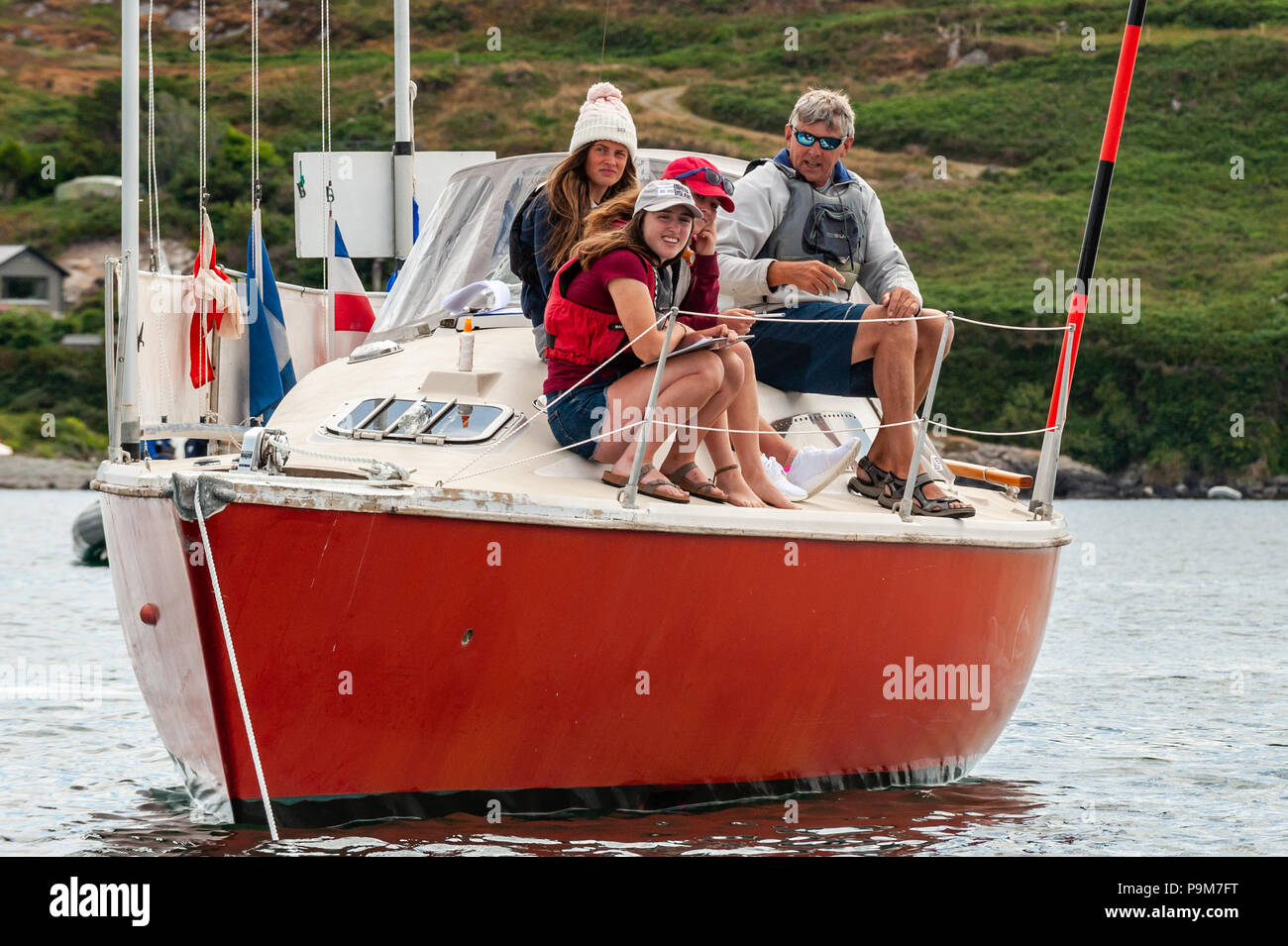 Schull, West Cork, Ireland. 19th July, 2018. Young people come from all over the island of Ireland, including the North, to take part in the schools regatta which is aimed at novice racing sailors. The Committee Boat during the races, staffed by volunteers. Credit: Andy Gibson/Alamy Live News. Stock Photo