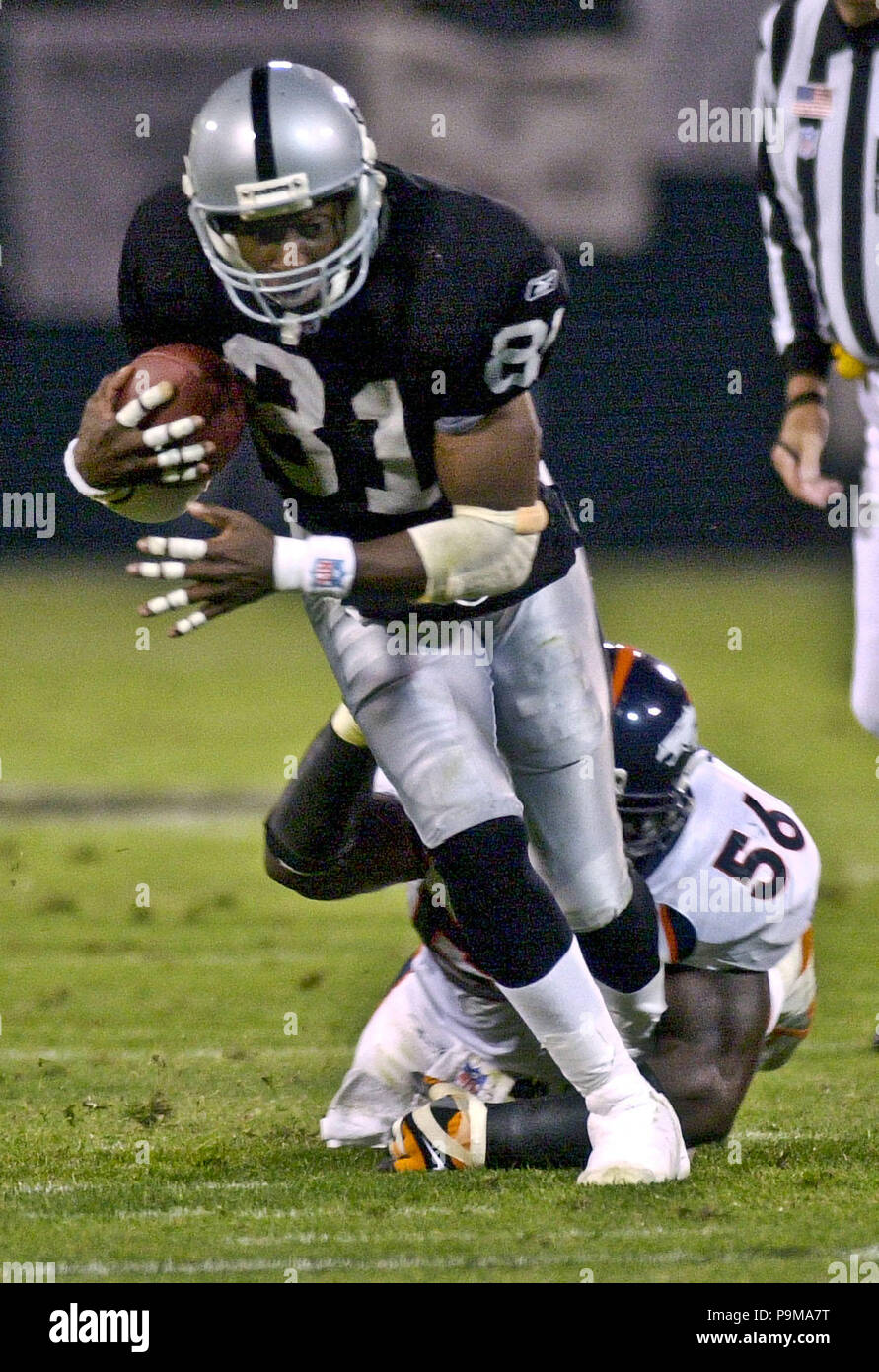 Oakland, California, USA. 5th Nov, 2001. Oakland Raiders wide receiver Tim  Brown (81) pulls away from Denver Broncos linebacker Al Wilson (56) on  Monday, November 5, 2001, in Oakland, California. The Raiders