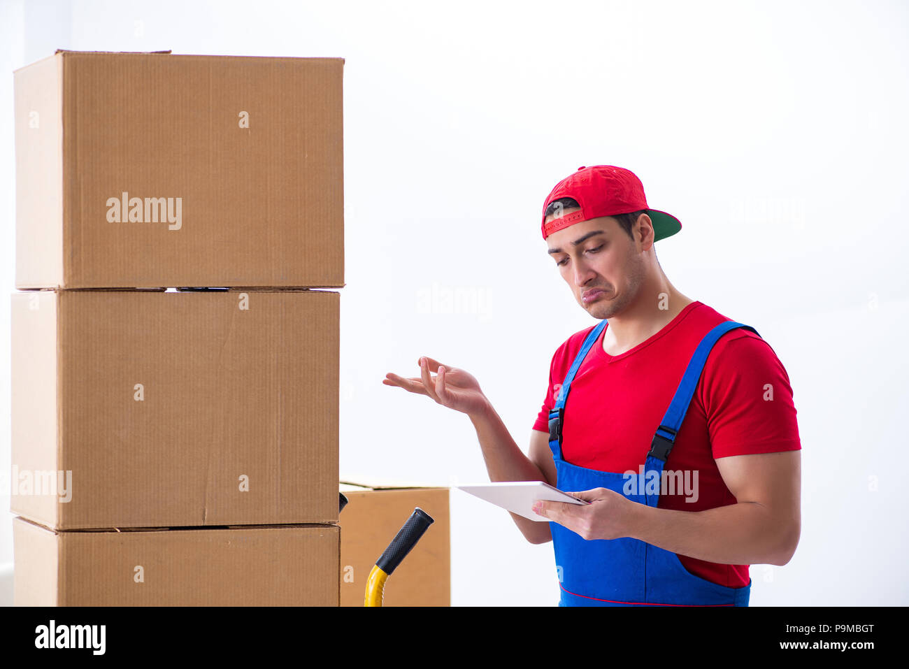 Contractor worker moving boxes during office move Stock Photo - Alamy