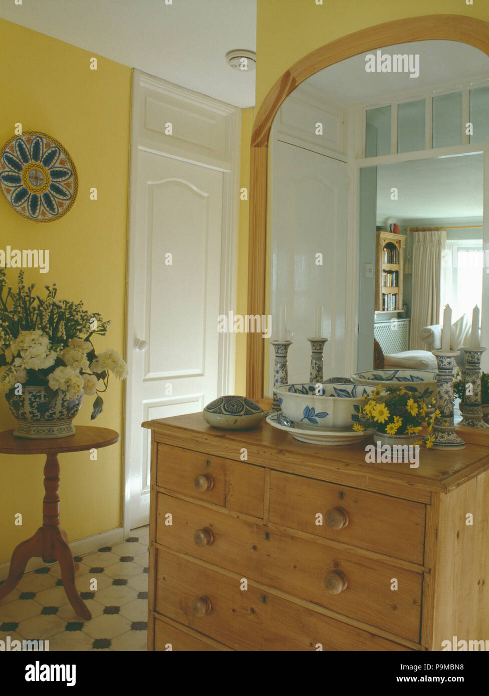 Large Pine Mirror Above Pine Chest Of Drawers In Small Yellow Hall