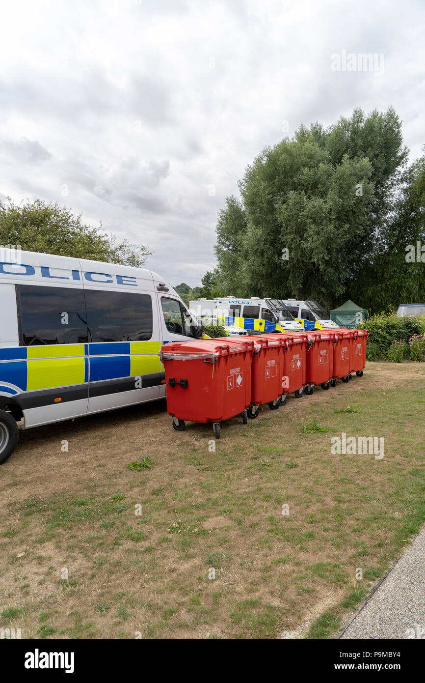 Line of red wheelie bins in Queen Elizabeth Gardens Salisbury UK Stock Photo