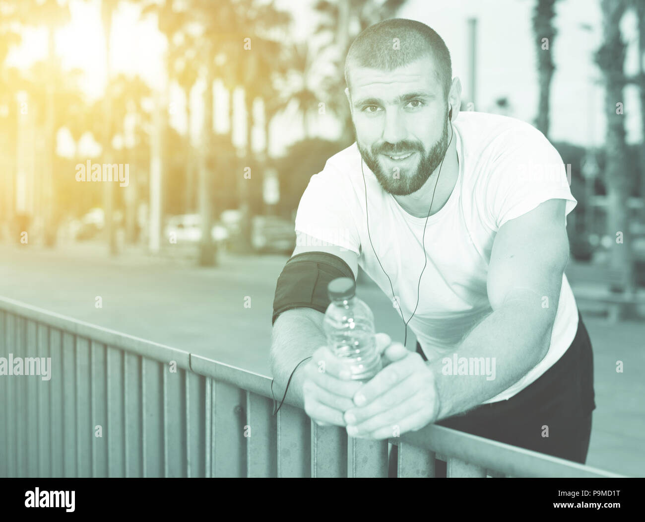 Sports man was out of breath during intense runs Stock Photo - Alamy