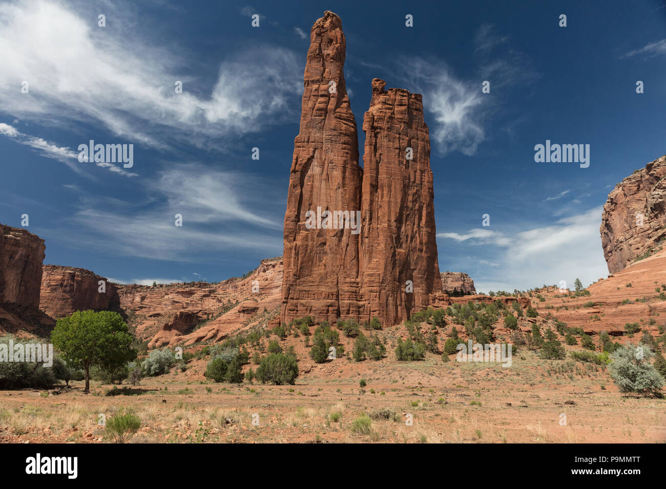Sandstone rocks, high cliffs and blue skies all inside Canyon de Chelly National Monument in