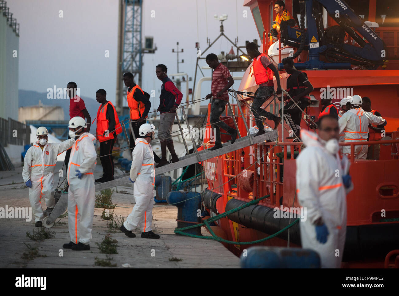 Migrants who were rescued from a dinghy in the Mediterranean Sea seen ...