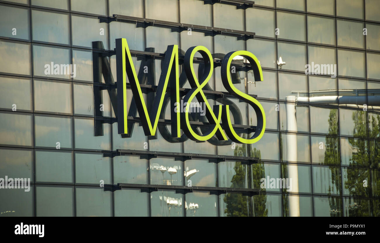 Large sign on the outside of the glass fronted branch of Marks and Spencer on the retail park in Leckwith on the outskirts of Cardiff. Stock Photo