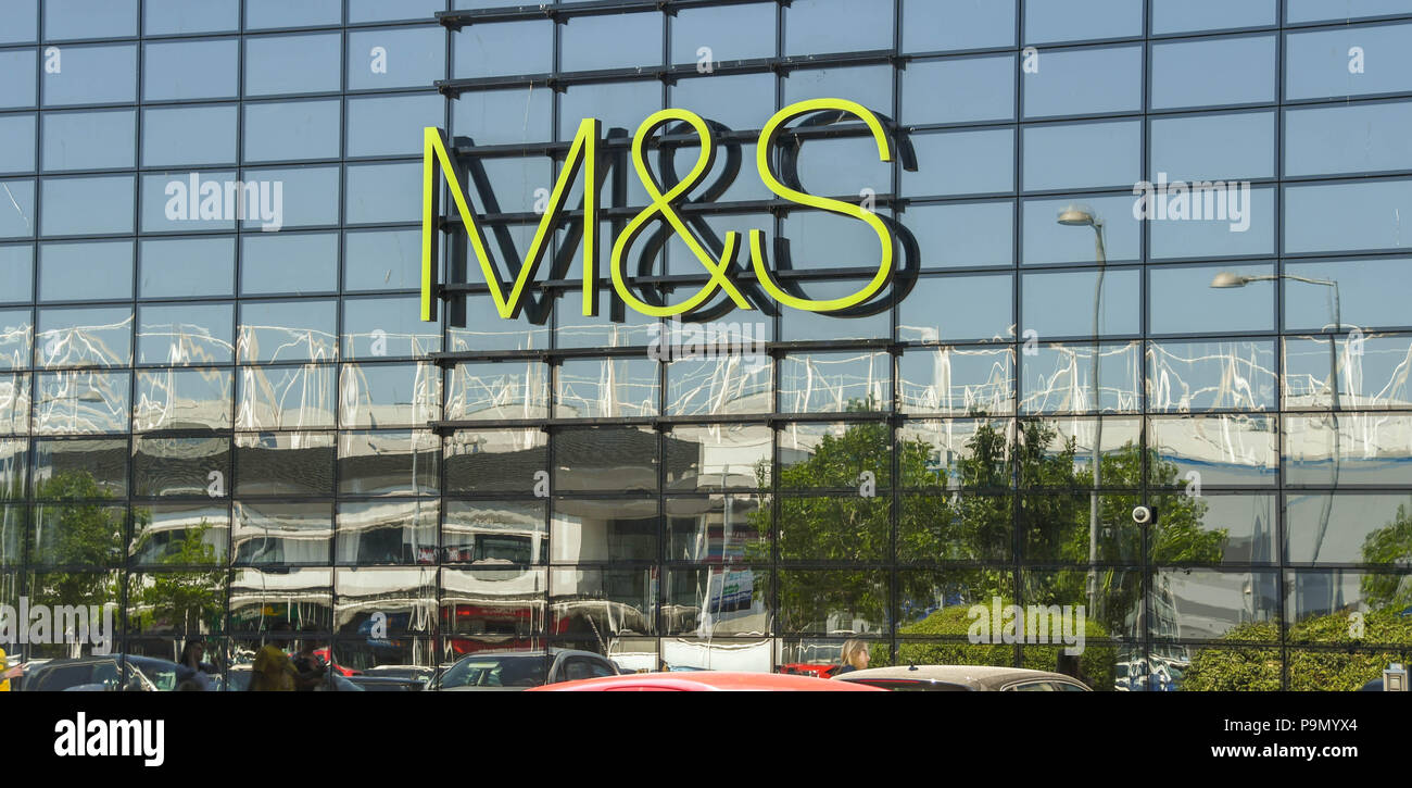 Large sign on the outside of the glass fronted branch of Marks and Spencer on the retail park in Leckwith on the outskirts of Cardiff. Stock Photo