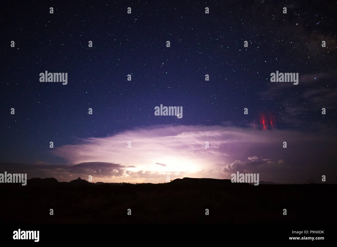 Red sprites (cold plasma lightning) over a strong thunderstorm near Ajo, Arizona, USA Stock Photo