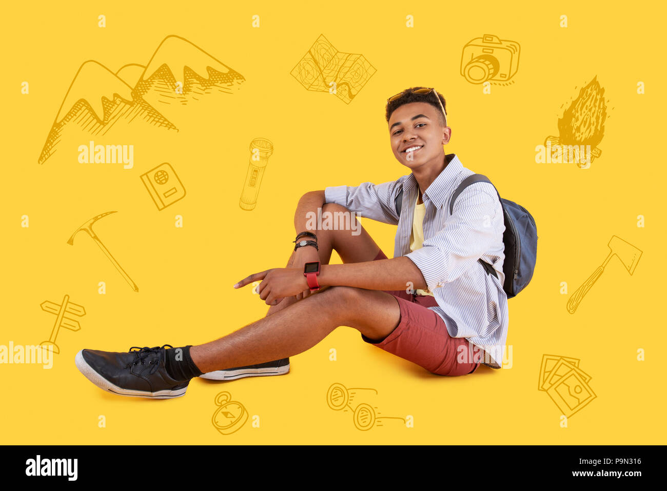 Happy traveler feeling relaxed while sitting and having a rest Stock Photo