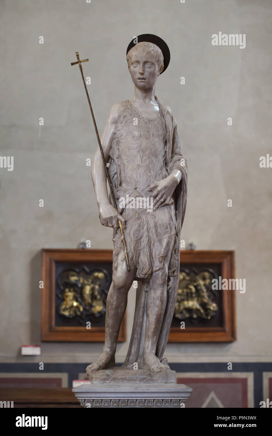 Marble statue of Saint John the Baptist (1450-1455) by Italian Renaissance sculptor Donatello finished by his pupil Desiderio da Settignano on display in the Bargello Museum (Museo Nazionale del Bargello) in Florence, Tuscany, Italy. Stock Photo