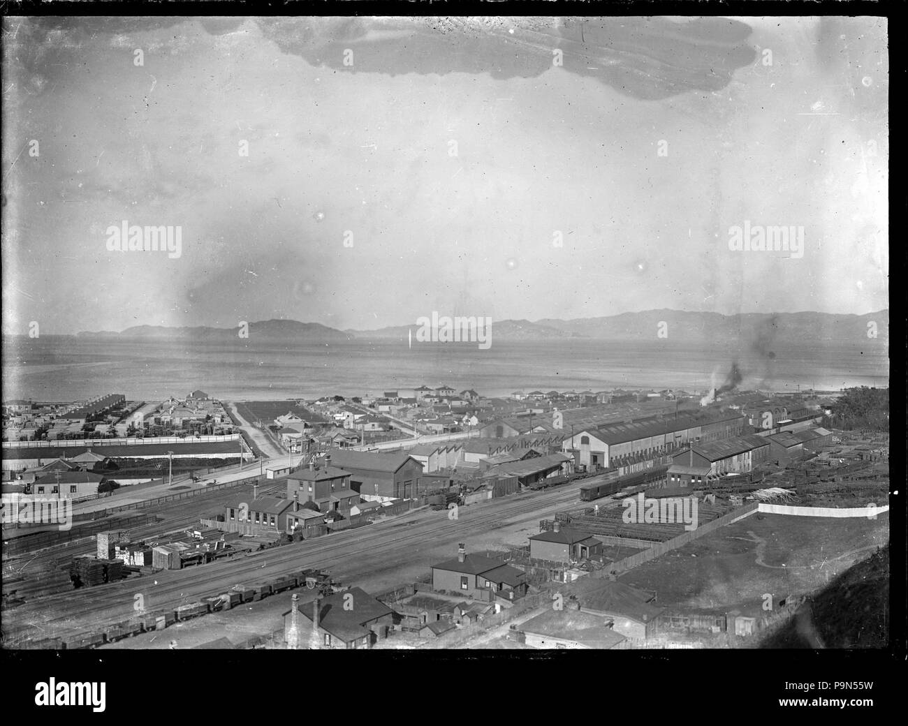 324 View of the Petone Railway Workshops looking towards Wellington Harbour, from Korokoro. ATLIB 287942 Stock Photo