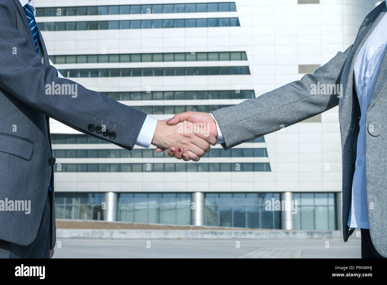 Asian business people shaking hands Stock Photo