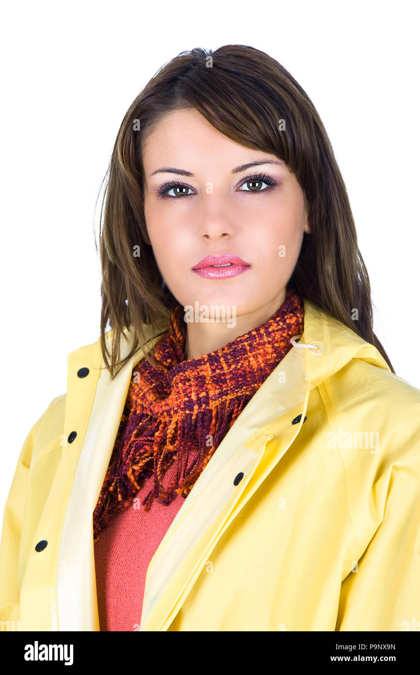 Beautiful young woman wearing a yellow rain-coat, studio shot Stock ...