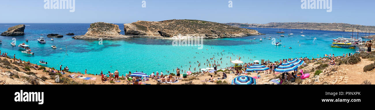 13 July 2018 - Comino Island, Malta. Panorama of the Blue Lagoon, exotic Meditteranean Sea coast in Comino island located in famous holiday destinatio Stock Photo