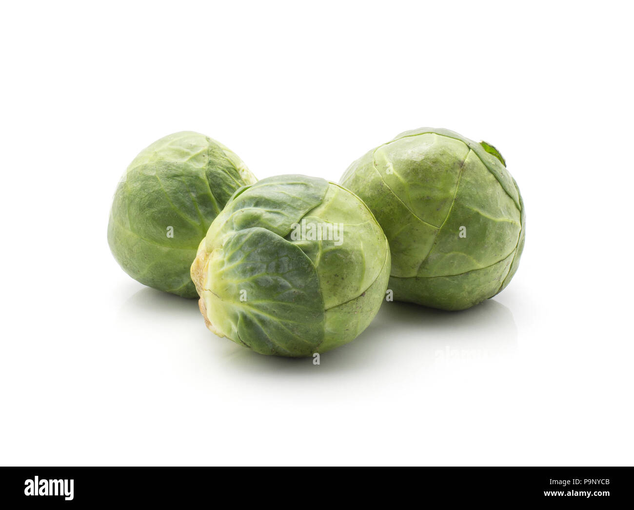 Raw Brussels sprout three heads isolated on white background Stock ...