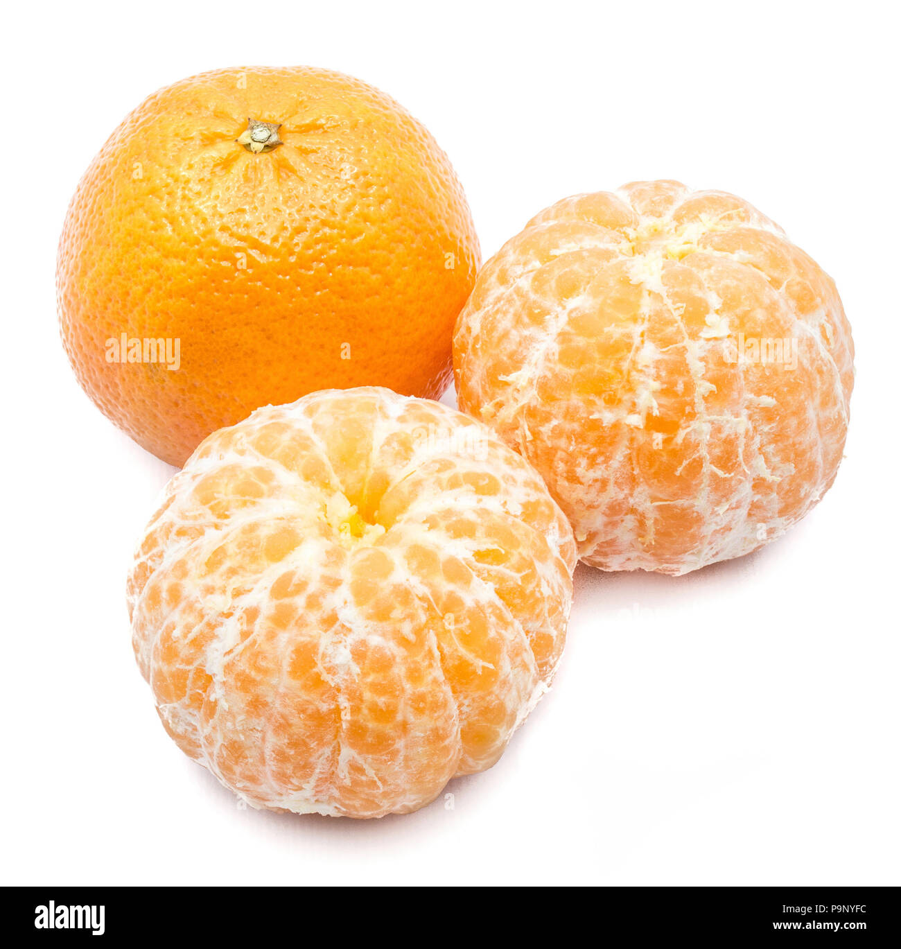 Three Clementines, one whole and two peeled, isolated on white