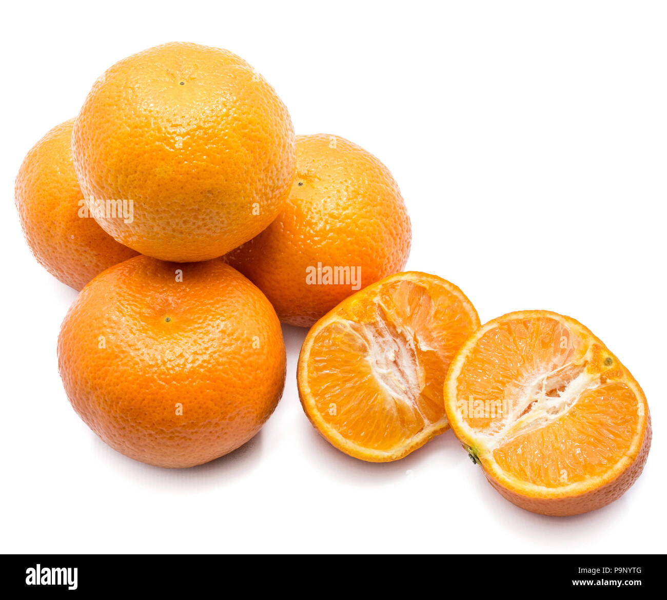 Four whole Clementines and two halves isolated on white background Stock Photo Alamy