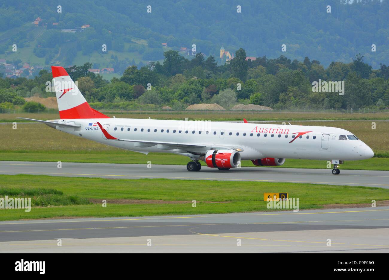 Austrian Airlines Erj-195 landing at LOWG, Graz airport, Austria Stock Photo