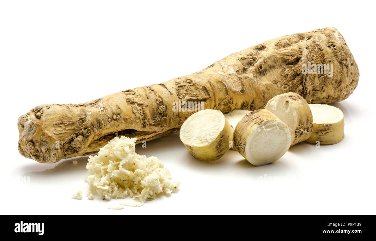 Fresh horseradish root isolated on white background one whole, sliced